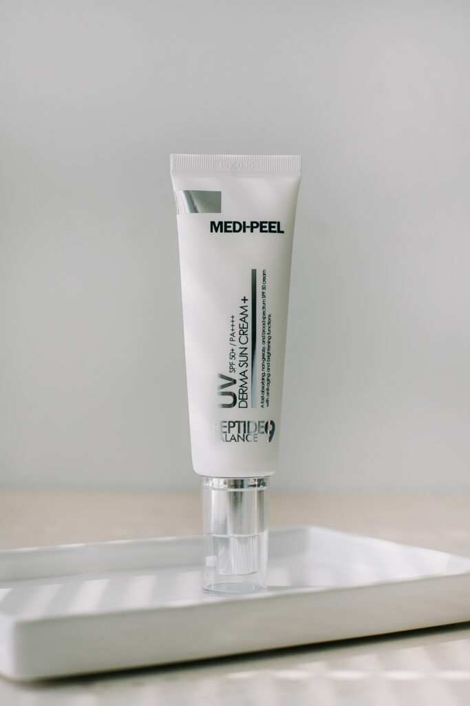 Солнезащитный крем с пептидами MEDI-PEEL Peptide 9 Balance UV Derma Sun Cream SPF50+ PA++++ 50ml