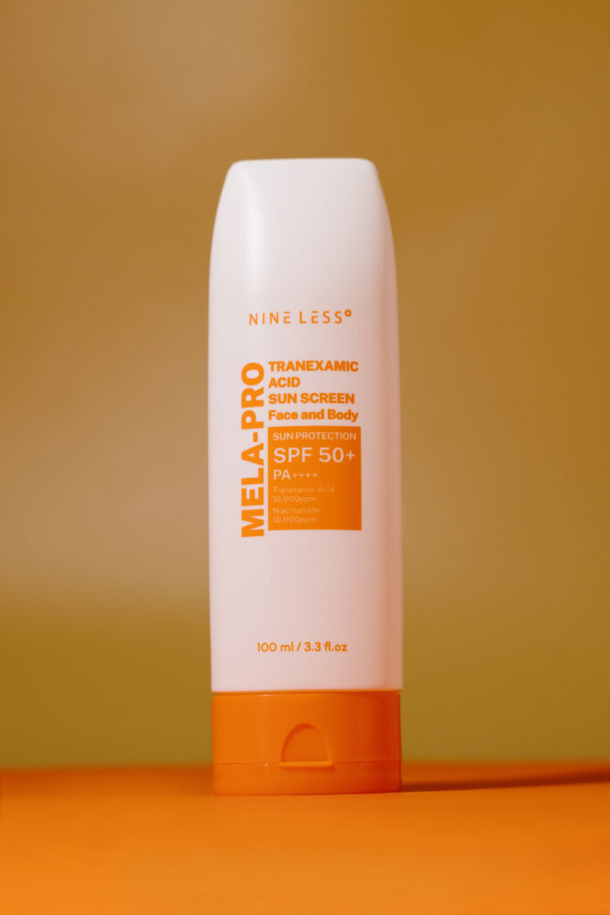 Солнцезащитный крем с транексамовой кислотой NINE LESS MELA-PRO Tranexamic Acid Sun Screen SPF 50PA++++ 100ml